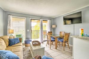 a living room with a couch and a table at Steps to Beach Ocean-View Hilton Head Villa! in Hilton Head Island