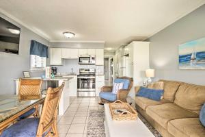 a living room with a couch and a table at Steps to Beach Ocean-View Hilton Head Villa! in Hilton Head Island