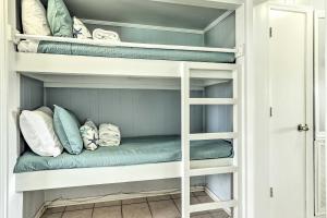 a white bunk bed with pillows on it at Steps to Beach Ocean-View Hilton Head Villa! in Hilton Head Island +18 photos
