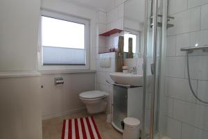 Koupelna v ubytování Ferienwohnung Dünennest + 14 fotografií