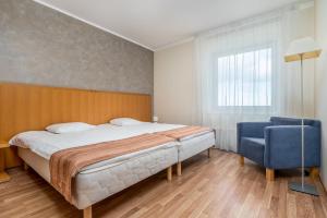Säng eller sängar i ett rum på Adelle Apartments Viru Keskuses, 9-th floor