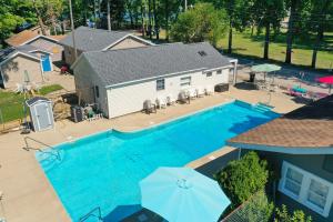 an overhead view of a swimming pool in front of a house at Outrigger Resort inc in Monticello