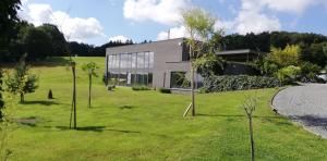 a house in the middle of a field at Les Croisettes 88, design loft XXL with amazing vue for peaceful stay in Trooz