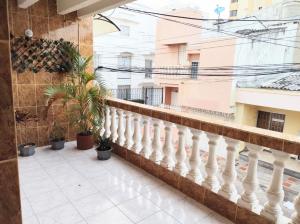 a balcony of a building with potted plants at Apartamentos Riohacha in Ríohacha