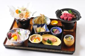a tray with different types of food on it at Yumoto Ginsenkaku in Kamikawa