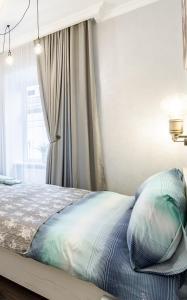 Posteľ alebo postele v izbe v ubytovaní Golden Rose ! Apartments Lviv