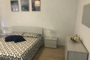 A bed or beds in a room at Casa Nanda Badia Prataglia