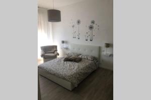 A bed or beds in a room at Casa Nanda Badia Prataglia