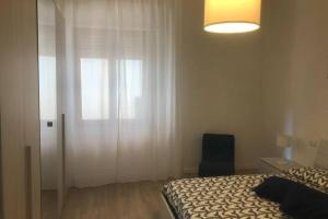 A bed or beds in a room at Casa Nanda Badia Prataglia