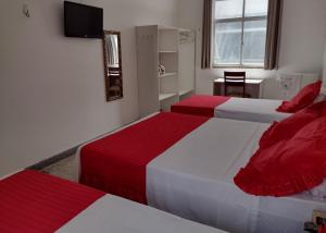 Säng eller sängar i ett rum på Hotel Marajoara