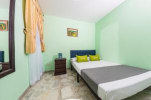 Postel nebo postele na pokoji v ubytování Hotel El Bosque