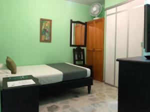 Postel nebo postele na pokoji v ubytování Hotel El Bosque