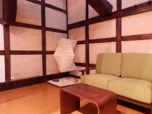 a living room with a couch and a table at Sumiyoshiya in Kanazawa