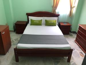 Postel nebo postele na pokoji v ubytování Hotel El Bosque