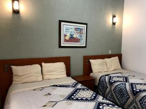 Tempat tidur dalam kamar di Hotel Casa Santo Domingo