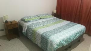 Ліжко або ліжка в номері Departamento - sector hospital Antofagasta