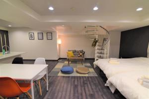 Postel nebo postele na pokoji v ubytování Hotel Central Yokohama