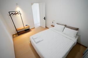Postel nebo postele na pokoji v ubytování Whammy House Dalat