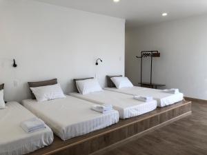 Postel nebo postele na pokoji v ubytování Whammy House Dalat