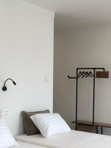 Postel nebo postele na pokoji v ubytování Whammy House Dalat