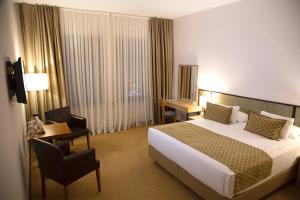 A bed or beds in a room at ATLAS OTELİ