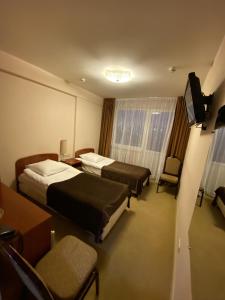Кровать или кровати в номере Гостиница Арена