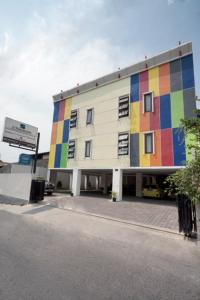 a building with a colorful facade on the side of it at DPARAGON MT HARYONO in Semarang