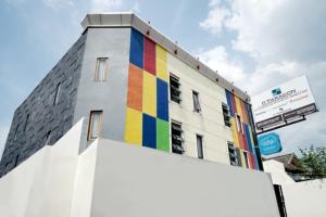 a building with a rainbow painted on the side of it at DPARAGON MT HARYONO in Semarang