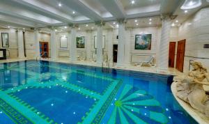 a large swimming pool with a large swimming pool at Lemon Tree Premier, Sabarmati Riverfront, Ahmedabad in Ahmedabad