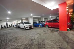 a group of cars parked in a parking lot at DPARAGON SONGGOLANGIT in Malang