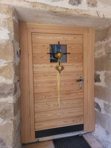 a wooden garage door with a basketball hoop on it at Ritschhof in Castelrotto