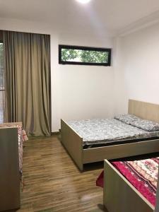Postel nebo postele na pokoji v ubytování Hotel Nino Ureki