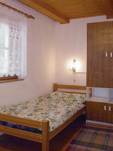Postel nebo postele na pokoji v ubytování Apartmány pri Studničke