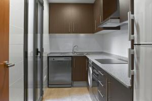 Kuchyňa alebo kuchynka v ubytovaní Barcelona Apartment Gran de Gràcia