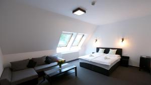 Кровать или кровати в номере Penzion FORMULA