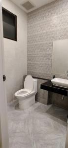 a bathroom with a toilet and a sink at หอพัก ทูเอ็มเพลส 2M Place Apartment in Ban Khlong Nung