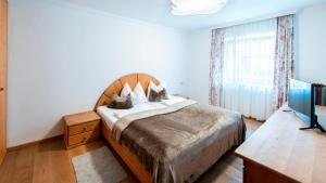 Łóżko lub łóżka w pokoju w obiekcie MANNI home - rooms & apartments