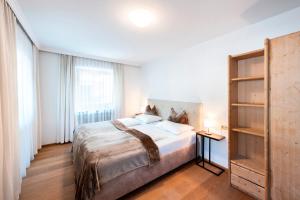 Łóżko lub łóżka w pokoju w obiekcie MANNI home - rooms & apartments