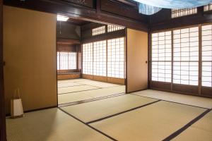 an empty room with windows in a building at tehen in Kyoto