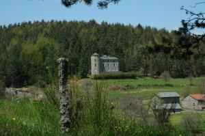 an old house on a hill in a field at La Rose des Vents in Les Vastres