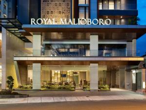 a building with a sign that reads roxy malibu at Royal Malioboro by ASTON in Yogyakarta