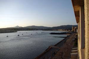 a view of a river with boats in the water at Txingudi by Basquelidays in Hondarribia
