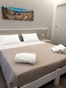 Postel nebo postele na pokoji v ubytování Casa Vacanze La Conca