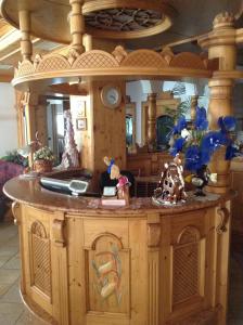 a kitchen with an island in a doll house at Hotel Pineta in Fiavè