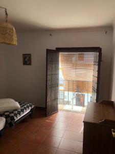 Posteľ alebo postele v izbe v ubytovaní Casa de Tita Dolores