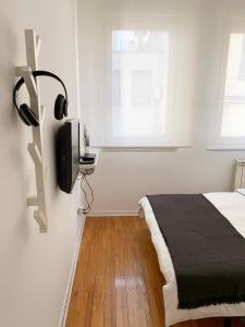 Ένα ή περισσότερα κρεβάτια σε δωμάτιο στο Miu Arena Apartment