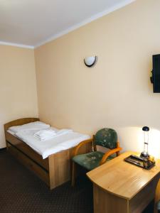 Postel nebo postele na pokoji v ubytování Ośrodek Wypoczynkowy Gwarek Ustronie Morskie