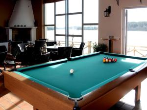 a pool table in a room with a pool ball at Södertuna Slott in Gnesta