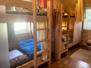 Postel nebo postele na pokoji v ubytování Bellscabin Guesthouse