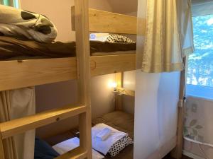 Postel nebo postele na pokoji v ubytování Bellscabin Guesthouse